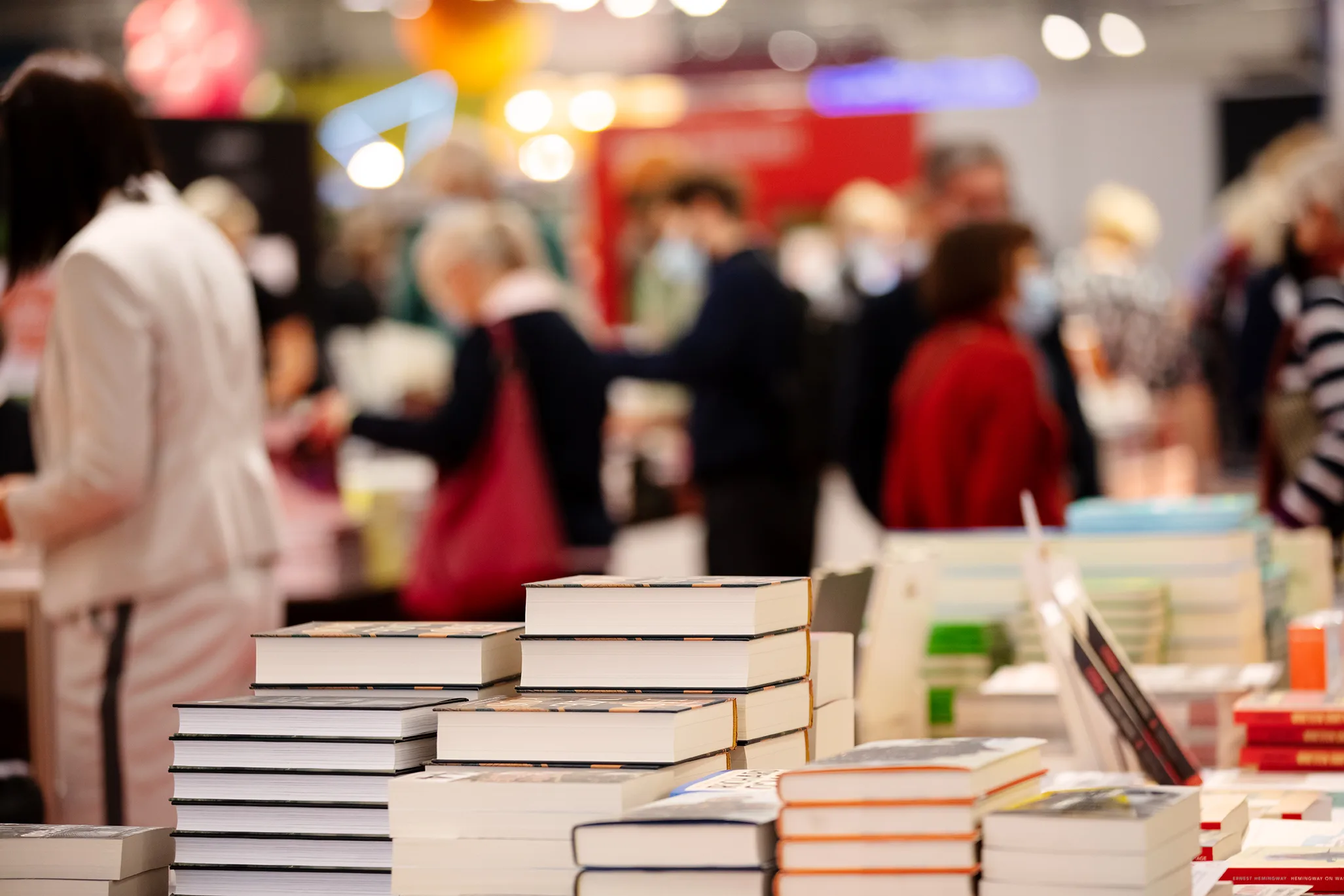 book piles at a book fair